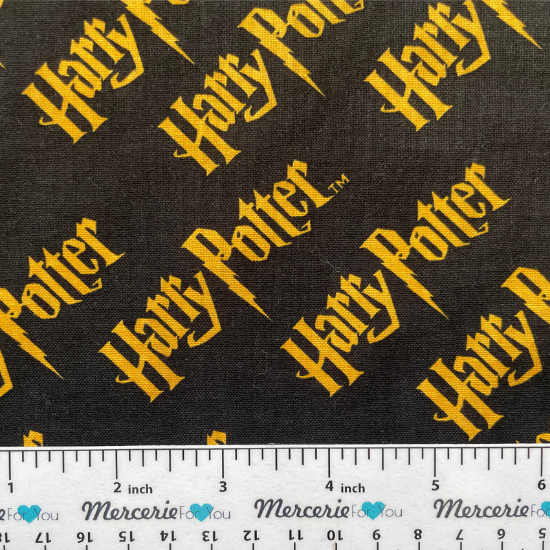 Harry Potter stoffa nera scritte gialle 